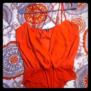 low cut orange onesie.